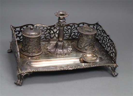 A Victorian silver inkstand with pierced three quarter gallery, two wells, taperstick and pen recess, George Ivory, London, 1856,